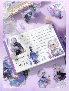 Detailed view of dreamy purple character stickers and magic bottle elements on a notebook
