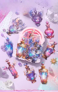 Macro shot of dream potion bottle stickers with gold accents for DIY scrapbooking decor