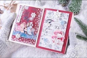 Close-up of vintage winter PET tape with bear stickers and snowflake DIY decor