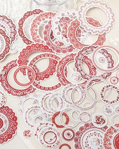 Detailed view of vintage lace circle stickers for journaling with floral patterns