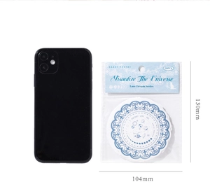 Macro shot of vintage blue lace dream stickers showing circular astronomy designs and size