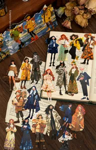 Detailed view of vintage illustration stickers featuring varied girl characters on old book pages
