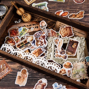 Pack de 300 pegatinas vintage con motivos retro y citas en caja de madera oscura