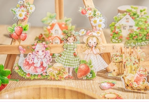 Detail van aardbeien PET-stickers met bloemmotieven en meisjes op een mini-ezeltje