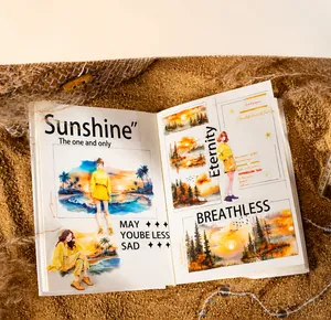 Detail of sunset landscape decorative stickers and journals on golden sand