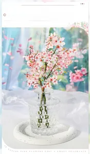 Macro shot of realistic pink floral PET stickers for scrapbooking in a glass jar