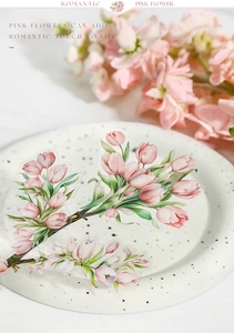 Detail of translucent pink tulip PET stickers on a porcelain plate for journaling decoration