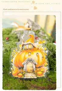 Macro detail of pumpkin house PET sticker with sparkling sand texture for DIY journals