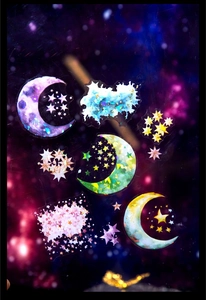 Vue macro d'autocollants holographiques lune et étoiles pour décoration de scrapbooking