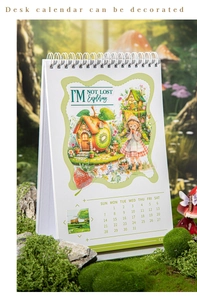 Detail view of fairy tale calendar with forest illustrations and spiral binding on moss