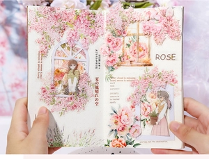 Detail of pink rose PET stickers and girl illustrations used for scrapbooking decor