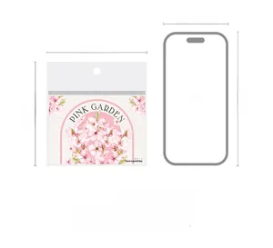 Detail of floral PET sticker packaging bag showing size comparison to iPhone 15