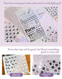 Detail of vintage collage scrapbooking paper with silver foil and vellum texture