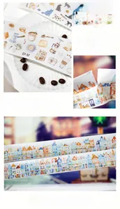 Macro view of vintage style washi tape with hand-drawn European buildings and cat motifs