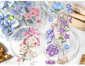Close-up of vintage floral PET stickers with flowers on glass for scrapbooking