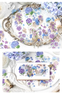 Macro detail of vintage hydrangea stickers with floral watercolor patterns and postal stamps