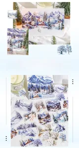 Detailed view of watercolor winter stickers featuring snowy mountains and forests on white fabric