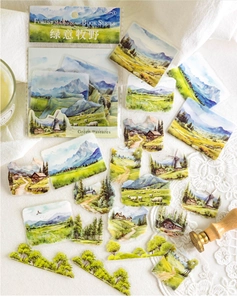 Close-up of PET nature stickers featuring watercolor forests and mountain landscapes