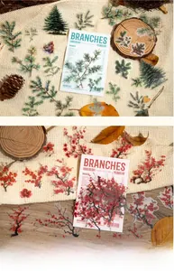 Macro detail of transparent PET botanical stickers featuring pine and red plum branches