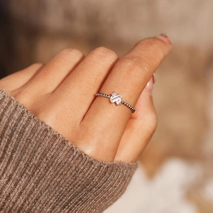 S925 Sterling Silver X-Cross ring with emerald cut center stone on a beaded band