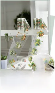Detail of transparent PET tape featuring realistic potted plant patterns with die-cut edges