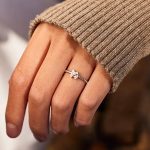 S925 sterling silver X-cross ring with emerald-cut white stone and beaded band