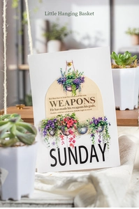 Close-up of artistic hanging basket succulent card on white linen fabric background