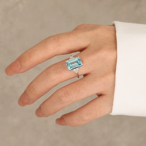 Elegant S925 sterling silver ring with large rectangular blue zircon and side accents