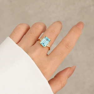 Elegant gold plated S925 silver ring with emerald cut blue zircon and side diamonds