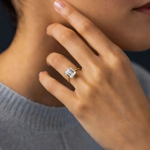Elegant gold S925 sterling silver ring featuring a large emerald cut cubic zirconia stone
