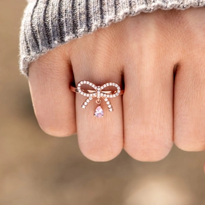 S925 silver rose gold bow ring with sparkling pavé and pink pear-shaped stone pendant