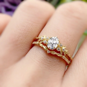 S925 silver gold leaf ring set with oval zircon and twisted wave band on finger