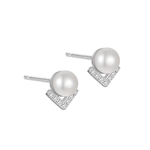 Macro detail of S925 silver stud earrings with V-shaped pavé diamonds and lustrous pearls