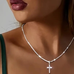 Sparkling S925 sterling silver cross pendant necklace with clear crystals on woman neck