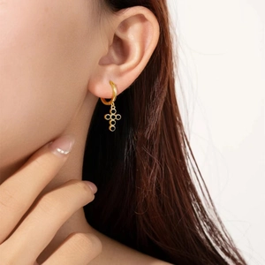 Minimalist s925 silver gold plated earrings with black zircon cross charm worn by model