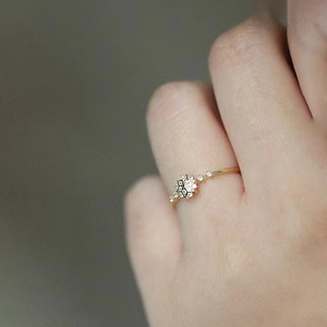 Elegant S925 sterling silver gold starburst ring featuring sparkling zircon accents