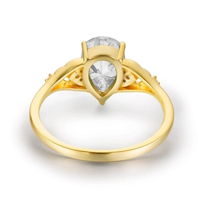 Detailed view of s925 gold flower ring featuring a pear-cut drop zircon and side stones