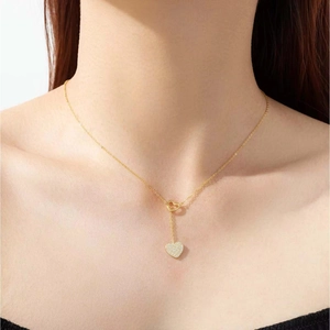 Elegant gold Y-shaped S925 sterling silver necklace featuring tassel and heart pendants