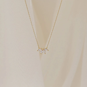 Minimalist S925 sterling silver leaf necklace with marquise-cut white crystals in gold finish