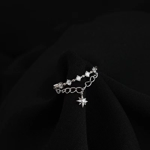 Close-up of S925 sterling silver ring with tassel chain and sparkling star pendant