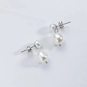 Elegant S925 sterling silver stud earrings featuring natural white baroque pearl drops