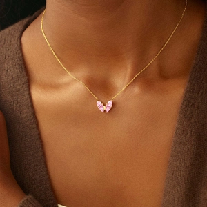 Elegant gold S925 silver necklace featuring a pink zircon butterfly pendant on a model