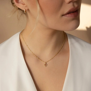 Elegant gold S925 sterling silver necklace with rhombus pendant and red gemstones