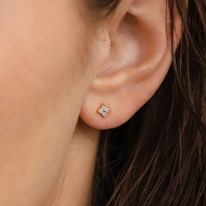 Minimalist s925 silver four leaf clover stud earrings with opal stone on a model