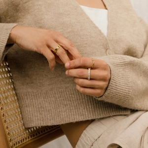 S925 sterling silver heart knot and zircon ring set shown on hand in natural light