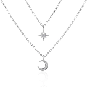 Detail of double-layer S925 silver necklace with micro-paved star and moon charms