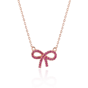 Detail of rose gold bow pendant necklace featuring pink pavé set cubic zirconia