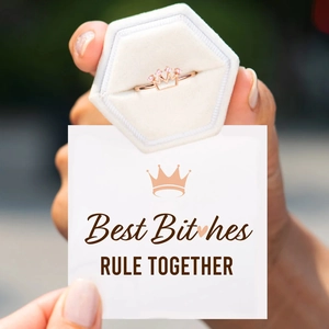 Rose gold crown ring with pink zircons in a velvet box with Best Bitches card
