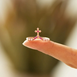 V-shaped rose gold cross ring with pink gemstones and elegant small pearls for women