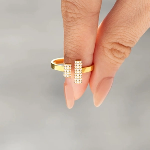 Close-up of a gold s925 silver double-T open ring featuring pavé set sparkling white diamonds